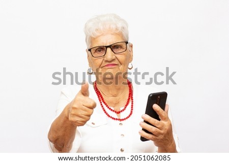 Close up photo of cheerful confident excited dreamy with wavy hair old granny lady taking making self portrait isolated grey background