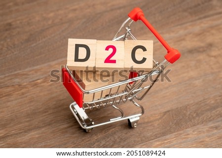 Concept of D2C (Direct to customer), shopping cart and the word “D2C” Royalty-Free Stock Photo #2051089424