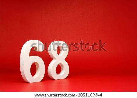 Sixty Eight ( 68 ) white number wooden Isolated Red Background with Copy Space - New promotion 68% Percentage   Business finance or birthday Concept - advertise banner picture online with copy space