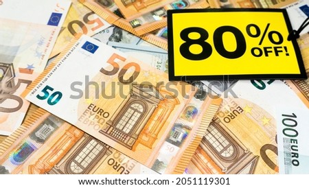 Yellow sale label on money euro background. Black friday sale. European money.