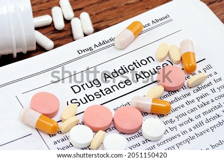 Information on drug addiction or substance abuse with varius pills scattered over the page.
Close up macro shot. Royalty-Free Stock Photo #2051150420