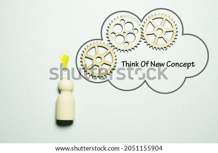 A picture of wooden nature people, gear, dialog box light bulb and the word Think of New Concept.