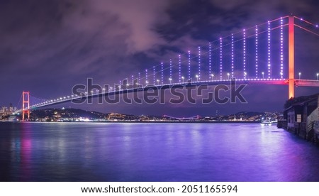 15 July Martyrs Bridge (15 Temmuz Sehitler Koprusu) Violet, purple cloudy sky and sea in Istanbul, Turkey. Istanbul Bosphorus Bridge, Panorama, long exposure. Royalty-Free Stock Photo #2051165594