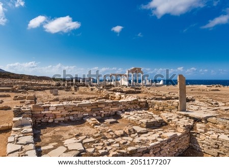 Archaic sanctuary in the archaeological site of Mandra, on the uninhabited Greek island of Despotiko in the Cyclades archipelago, with the reconstructed temple of Apollo and Artemis Royalty-Free Stock Photo #2051177207