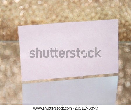 Business paper card with copyspace for text on golden background