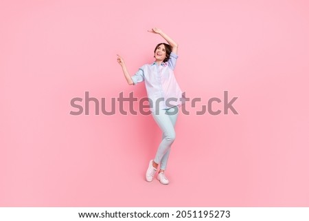 Full length body size photo woman smiling showing fingers copyspace isolated pastel pink color background