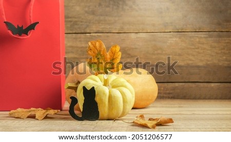 halloween sale. Happy Halloween background with pumpkins and red package. copy space text area, halloween sale