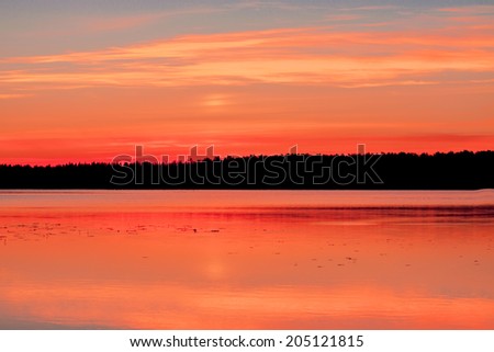 Beautiful landscape: forest lake at sunset