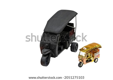golden shiny and black passenger 3 wheel car model or toy call tuk tuk taxi in bangkok of thailand isolated on white background with clipping path