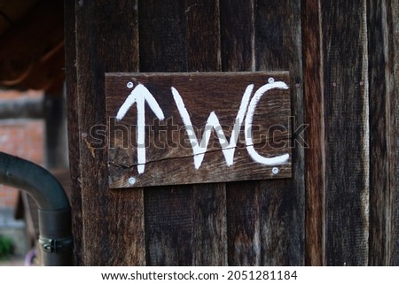 A closeup shot of a wooden wc sing