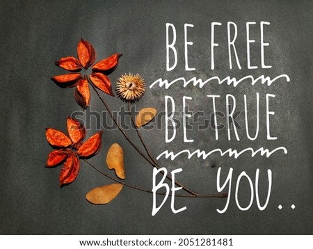 Quote of "BE FREE. BE TRUE BE YOU" with flowers and black background