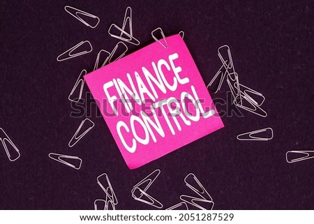 Text caption presenting Finance Control. Business overview procedures that are implemented to manage finances Multiple assorted collection office stationery photo placed over table
