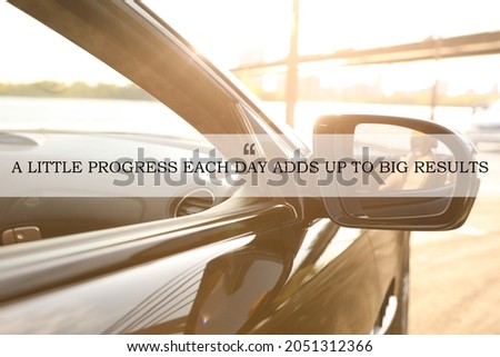 A Little Progress Each Day Adds Up To Big Results. Inspirational quote motivating to make small positive actions daily towards weighty effect. Text against luxury car, closeup