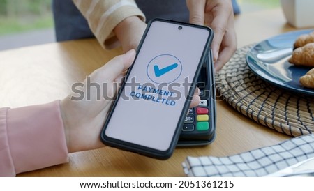 Asia young smile happy woman people in small sme coffee shop store use tapping cashless wifi qr code nfc scan app smart pos device reader sale in food drink order in cafe urban city life contactless.