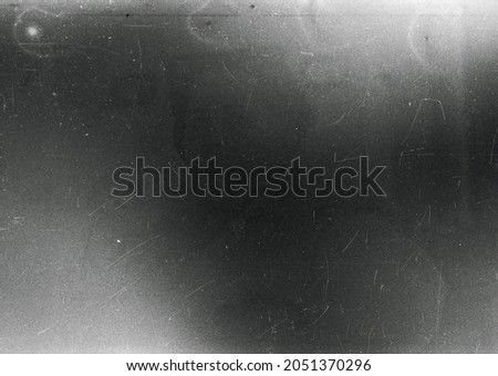 Dusty scratched grunge scanned old film texture Royalty-Free Stock Photo #2051370296