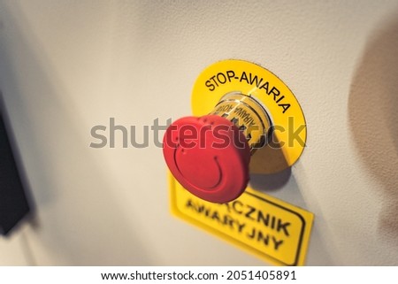 A closeup of the emergency switch with the words Stop Failure 