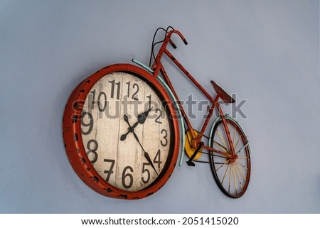 Vintage bicycle shaped wall clock hanging on the wall