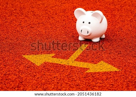 Piggy Bank And Yellow Arrow Signs Showing Various Direction. Choosing right financial decision.