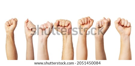 Group of people raised fists up as a victory, proud, success or strength symbol  Royalty-Free Stock Photo #2051450084