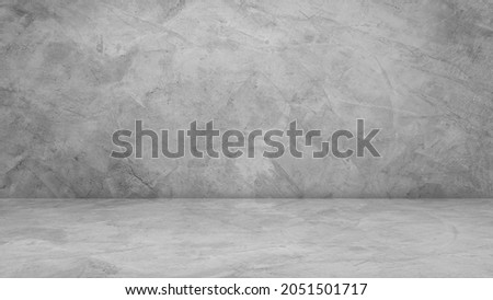 Empty Gray Wall Room interiors Studio Concrete Backdrop and Rough Floor stage Cement Shelf, well editing montage display advertising products and text present on free space Background  Royalty-Free Stock Photo #2051501717