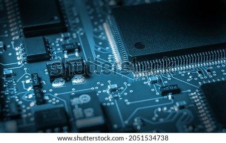 electronic board with active and passive surface mounted components close up Royalty-Free Stock Photo #2051534738