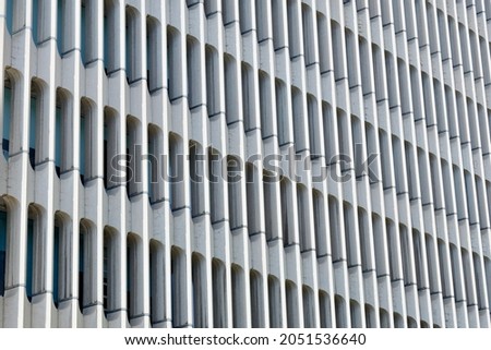 Textured facade with minimal lines on the building outside in Madrid, Spain