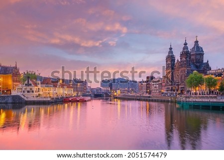 Amsterdam downtown city skyline cityscape of Netherlands at sunset Royalty-Free Stock Photo #2051574479