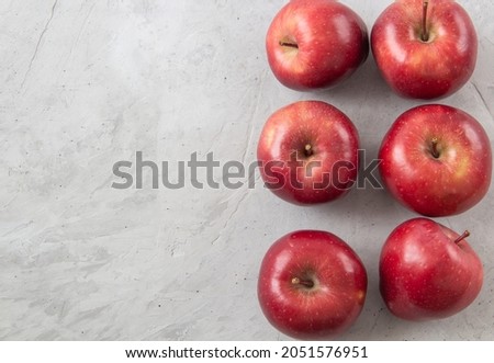 Fresh red apples on a gray background with copy space. view from above. agriculture. Fortified product. Vegetarian food. 
