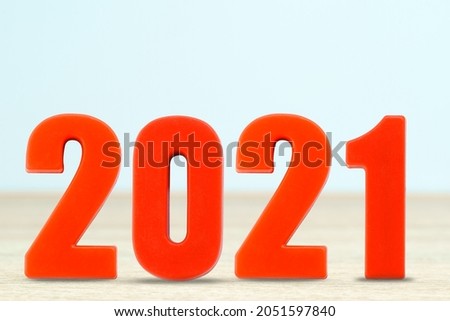 Shot of a number 2021 made of red plastic new year on table with copy space