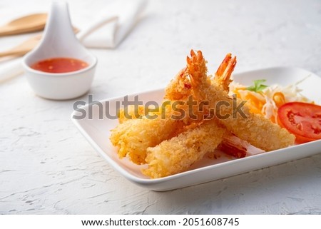 Crispy fried shrimp.Deep fry shrimp with Breadcrumbs on white plate with chilli sweet sauce Royalty-Free Stock Photo #2051608745