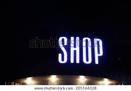 Neon sign on store at night