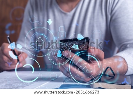 A client is signing the contract to create a software to present it at start up conference and gain investments for innovative service. Checking the details at smartphone. Hologram tech graphs.