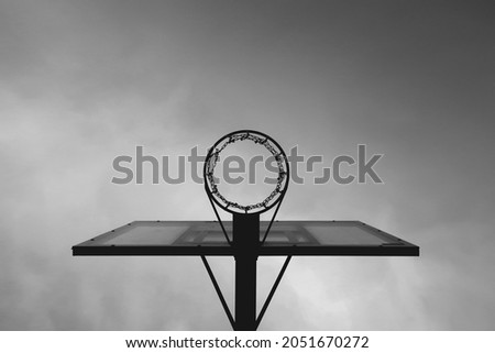 Black and white photograph of a basketball hoop. Street style                