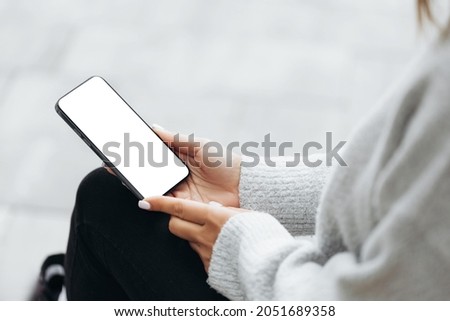 Woman use the iPhone 13 pro with white screen