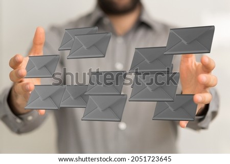 A 3D rendering of digital envelopes floating in between male's hands- online communication concept