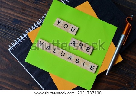 you are valuable, text words typography on wooden background, life and business motivational inspirational concept