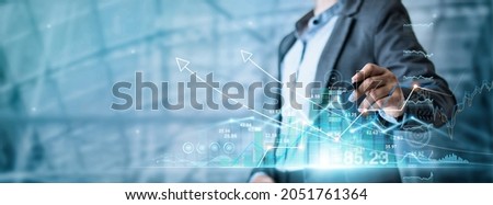 Businessman draw graph growth of business amid the global economic crisis, Strategy and planning, Recovery of business,  Analyzing and data exchange on global networking.  Royalty-Free Stock Photo #2051761364