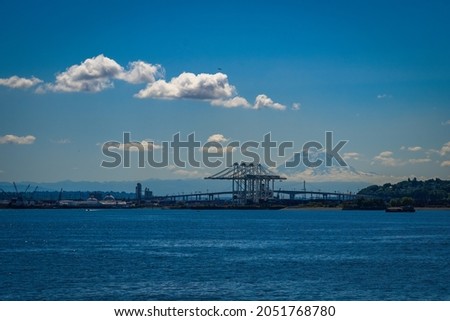  HARBOR ISLAND WITH THE WEST SEATTLE HIGH RISE AND MOUNT RAINIER ON ELLIOTT BAY Royalty-Free Stock Photo #2051768780