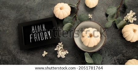 Pumpkin and eucalyptus harvest an black friday composition. Holiday season concept. Top view, flat lay, copy space