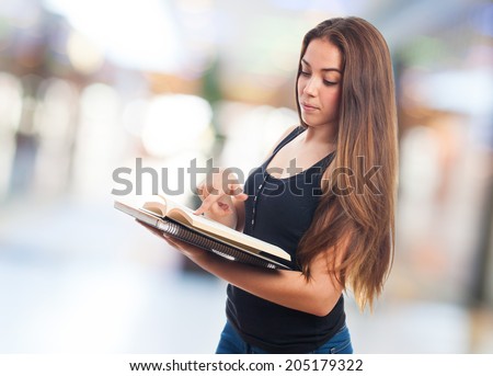 portrait of a young student reading a book