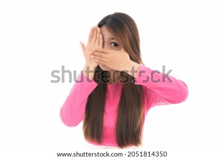 Happy surprised excited business Asian woman peeking through fingers
,concept of human emotions and facial expression,portrait of beautiful Asian woman,isolated on white background