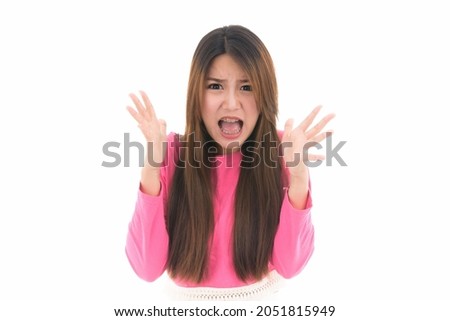Young Asian woman feeling shocked and excited screams,amazed and happy because of an unexpected surprise, concept of human emotions and facial expression,portrait of beautiful Asian