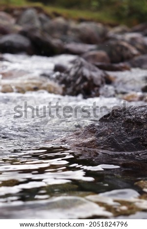 Close up of beautiful sparkling small shallow stream