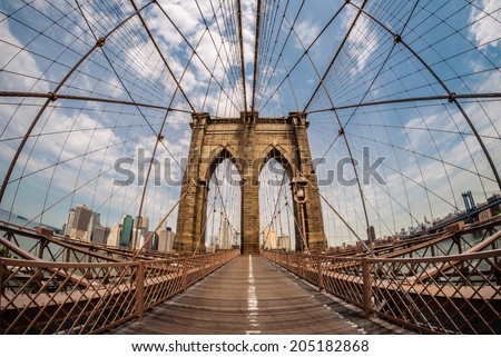 Brooklyn bridge and New York city in the background from a fish eye perspective Royalty-Free Stock Photo #205182868
