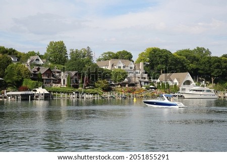 The beautiful harbor in Charlevoix, Michigan, a popular summer recreation destination in Northern Michigan Royalty-Free Stock Photo #2051855291