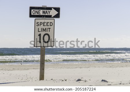 Two traffic signs together for those who would drive on the beach in St. Augustine, Florida, USA