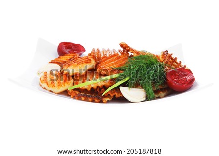 potato chips served with small pickled eggplants on small white plate isolated on white background