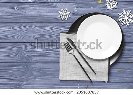 Beautiful Christmas table setting on color wooden background