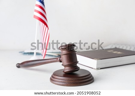 Judge's gavel and USA flag on white background