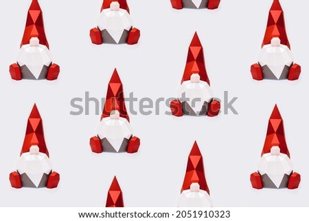 Cute Christmas gnomes in red pointed hat with white beard, paper polygonal figure dwarf, New Year holiday pattern, minimal style.